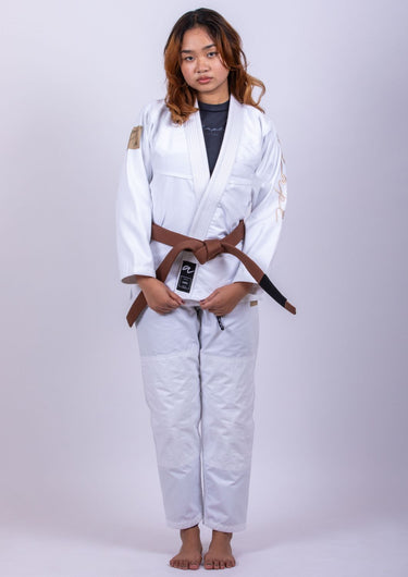 Women’s signature BJJ gi in white with 450 GSM jacket and 10 oz rip‑stop pants; premium embroidered design.