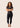 Women’s technical BJJ rashguard in black and gold, featuring four‑way stretch and mesh ventilation.