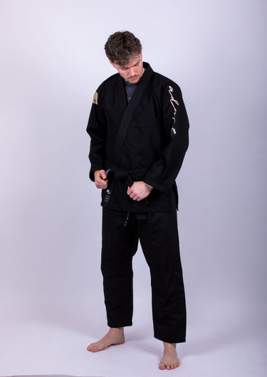 Men’s signature BJJ gi in black with 450 GSM jacket and 10 oz rip‑stop pants; premium embroidered design.
