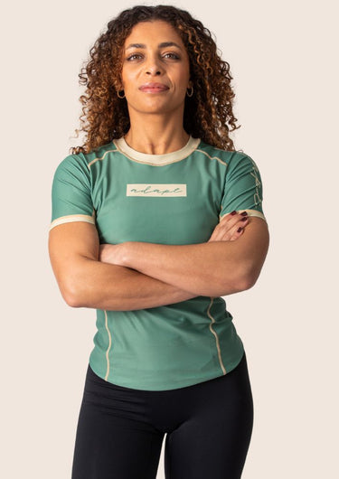 Women’s technical BJJ rashguard in matcha green, featuring four‑way stretch and mesh ventilation.