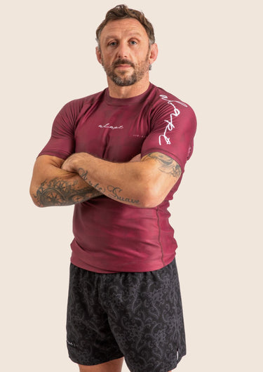 Men’s Prism BJJ rashguard in deep maroon Jacquard Lycra with geometric prism pattern, short sleeves, compression fit.