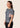 Women’s ash‑rose technical BJJ rashguard; muted pink on grey colour with underarm mesh ventilation.