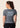 Women’s ash‑rose technical BJJ rashguard; muted pink on grey colour with underarm mesh ventilation.