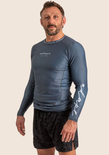 Men’s long‑sleeved technical BJJ rashguard in Blue, featuring four‑way stretch and mesh ventilation.
