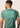 Men’s technical BJJ rashguard in matcha green, featuring four‑way stretch and mesh ventilation.