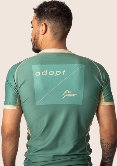 Men’s technical BJJ rashguard in matcha green, featuring four‑way stretch and mesh ventilation.