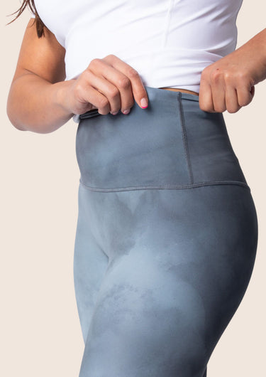 Women’s high‑waisted training leggings in onyx grey; matte finish; supportive compression.
