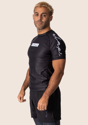 Men’s original BJJ rashguard in black, minimalistic design, 100% IBJJF legal.
