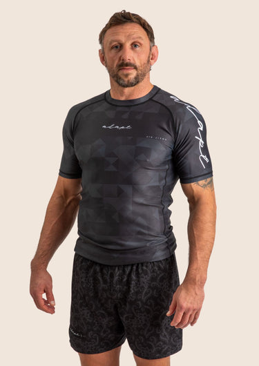Men’s Prism BJJ rashguard in black Jacquard Lycra with geometric prism pattern, short sleeves, compression fit.