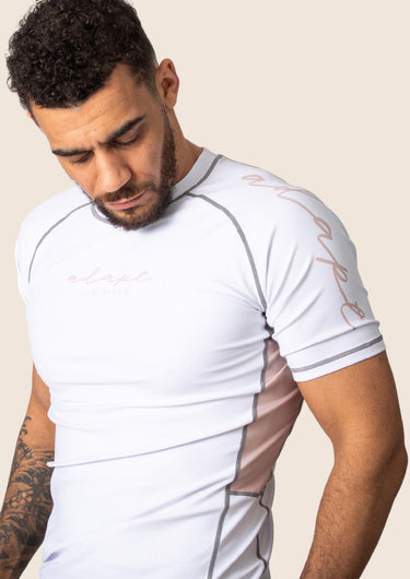 Men’s snow rose technical BJJ rashguard in white and pink, featuring four‑way stretch and mesh ventilation.