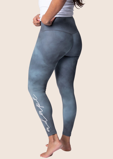 Women’s high‑waisted training leggings in onyx grey; matte finish; supportive compression.