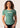 Women’s technical BJJ rashguard in matcha green, featuring four‑way stretch and mesh ventilation.