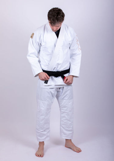 Men’s signature BJJ gi in white with 450 GSM jacket and 10 oz rip‑stop pants; premium embroidered design.