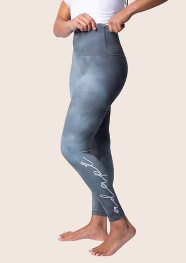 Women’s high‑waisted training leggings in onyx grey; matte finish; supportive compression.