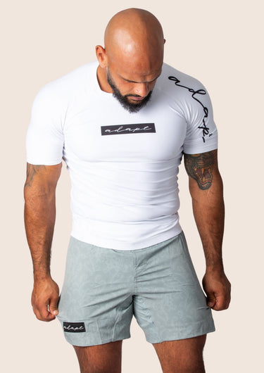 Men’s original BJJ rashguard in white, minimalistic design, 100% IBJJF legal.