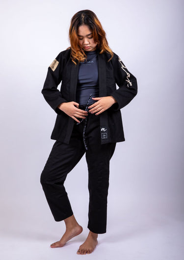 Women’s signature BJJ gi in black with 450 GSM jacket and 10 oz rip‑stop pants; premium embroidered design.