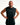 A muscular man with short blond hair and a beard poses with hands on hips wearing a black sleeveless athletic tank top with a white script logo on the chest, set against a plain white studio background.