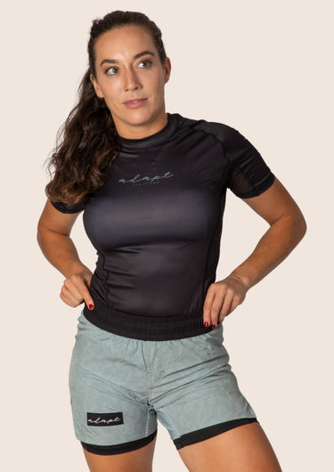 Women’s classic BJJ rashguard in Black; feminine cut; simple classic design.