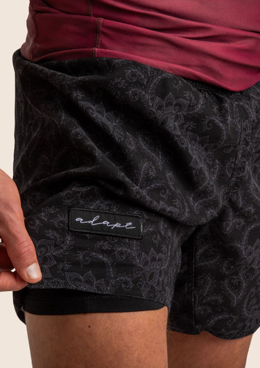 Unisex Jiu-Jitsu dual‑layer combination shorts with black paisley pattern; built‑in compression liner; adjustable fit.