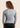 Women’s long‑sleeved technical BJJ rashguard in Silver, featuring four‑way stretch and mesh ventilation. Unique womens fit.