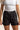 Unisex Jiu‑Jitsu training shorts in solid black; lightweight fabric with adjustable waistband