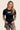 Women’s original BJJ rashguard in black, minimalistic design, 100% IBJJF legal.