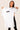 Women’s original BJJ rashguard in white, minimalistic design, 100% IBJJF legal.