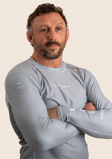 Men’s long‑sleeved technical BJJ rashguard in Silver, featuring four‑way stretch and mesh ventilation.