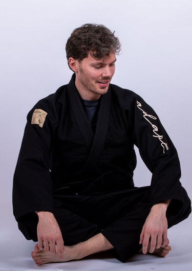 Men’s signature BJJ gi in black with 450 GSM jacket and 10 oz rip‑stop pants; premium embroidered design.