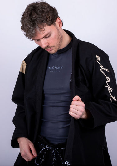 Men’s signature BJJ gi in black with 450 GSM jacket and 10 oz rip‑stop pants; premium embroidered design.