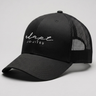 A black trucker-style baseball cap with a curved brim, black mesh back panels, and white embroidered text reading 'elapse JIU-JITSU' on the front, photographed on a light gray studio background.