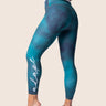 Women’s high‑waisted training leggings in mermaid blue with gradient effect; sleek and squat‑proof.