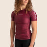 Women’s prism BJJ rashguard in maroon with geometric prism design; short sleeves.