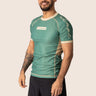 Men’s technical BJJ rashguard in matcha green, featuring four‑way stretch and mesh ventilation.
