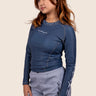 Women’s long‑sleeved technical BJJ rashguard in Blue, featuring four‑way stretch and mesh ventilation. Unique womens fit. 