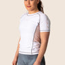 Women’s snow rose technical BJJ rashguard in white and pink, featuring four‑way stretch and mesh ventilation. Unique womens cut. 