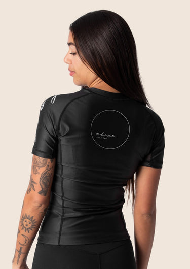 Women’s original BJJ rashguard in black, minimalistic design, 100% IBJJF legal.
