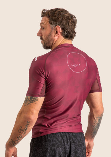 Men’s Prism BJJ rashguard in deep maroon Jacquard Lycra with geometric prism pattern, short sleeves, compression fit. 