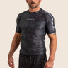 Men’s Prism BJJ rashguard in black Jacquard Lycra with geometric prism pattern, short sleeves, compression fit. 