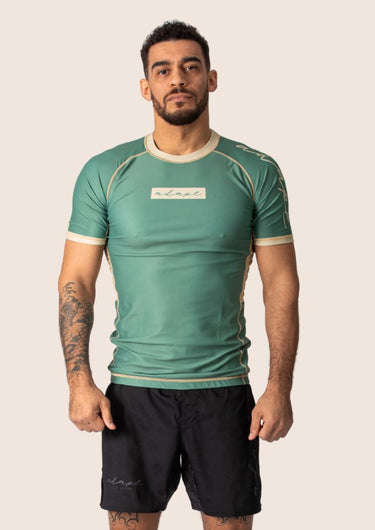 Men’s technical BJJ rashguard in matcha green, featuring four‑way stretch and mesh ventilation.