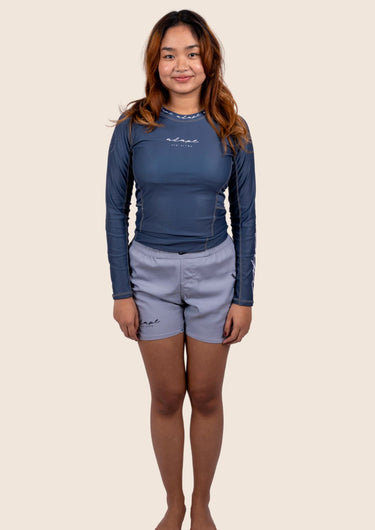 Women’s long‑sleeved technical BJJ rashguard in Blue, featuring four‑way stretch and mesh ventilation. Unique womens fit. 