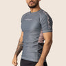 Men’s ash‑rose technical BJJ rashguard with muted pink‑rose hue and performance mesh panels