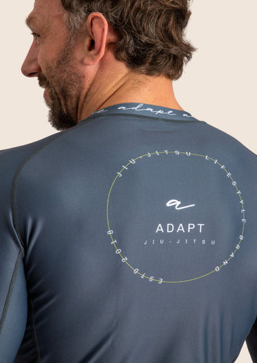 Men’s long‑sleeved technical BJJ rashguard in Blue, featuring four‑way stretch and mesh ventilation. 