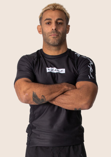 Men’s original BJJ rashguard in black, minimalistic design, 100% IBJJF legal. 