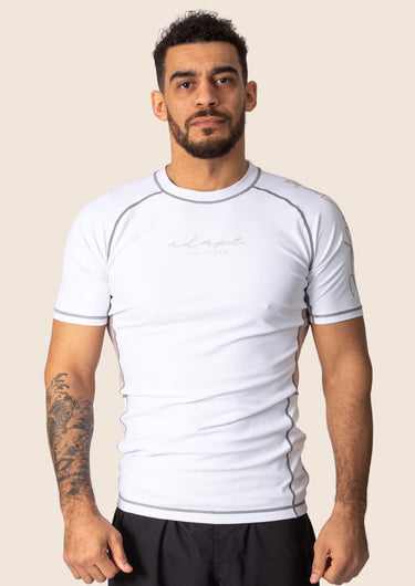 Men’s snow rose technical BJJ rashguard in white and pink, featuring four‑way stretch and mesh ventilation.