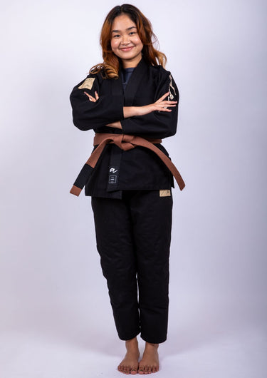 Women’s signature BJJ gi in black with 450 GSM jacket and 10 oz rip‑stop pants; premium embroidered design.