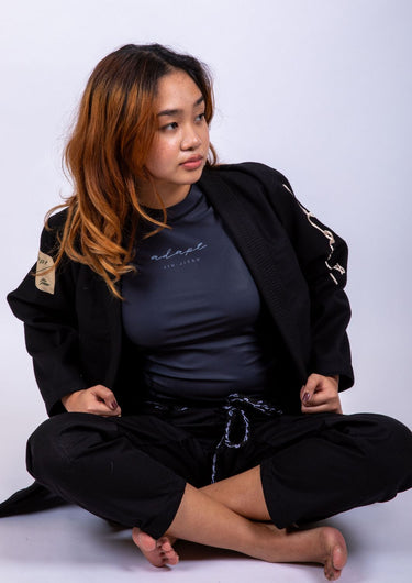 Women’s signature BJJ gi in black with 450 GSM jacket and 10 oz rip‑stop pants; premium embroidered design.