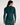 A woman shown from the back wearing a dark teal long-sleeve athletic rash guard and matching leggings against a plain light background. The brand name 'adapt' is printed in white script on the upper back of the rash guard.