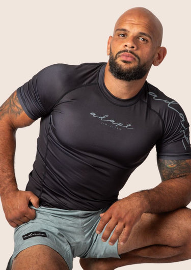 Mens Classic black BJJ rashguard with a pair of sage paisley grappling shorts 