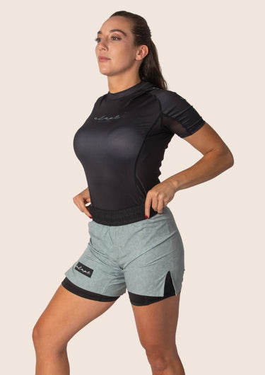 Unisex dual‑layer combination shorts with sage green paisley pattern; built‑in Lycra liner; secure fit.